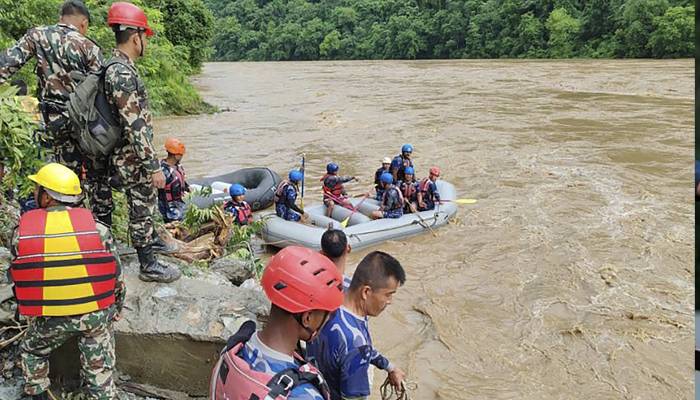 2 buses swept by landslide in nepal river