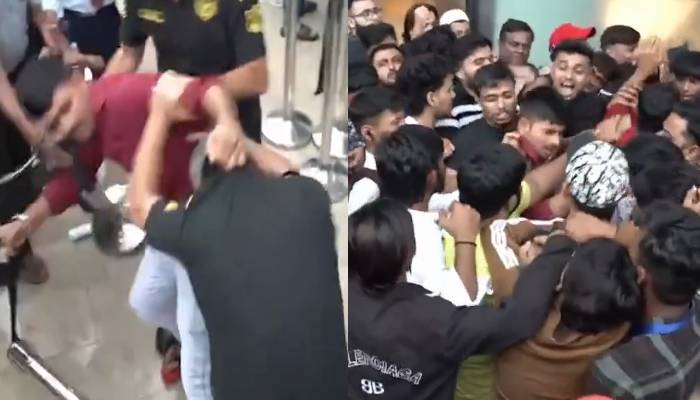ویڈیو: نئے آئی فون کی خریداری کے دوران نوجوان گتھم گتھا، تھپڑوں، گونسوں کی بارش